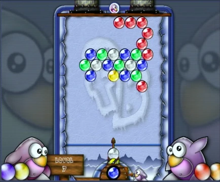 Frozen Bubble gameplay with penguin launcher and colorful bubble grid