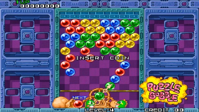 Bust-A-Move arcade gameplay screenshot showing classic bubble-matching board